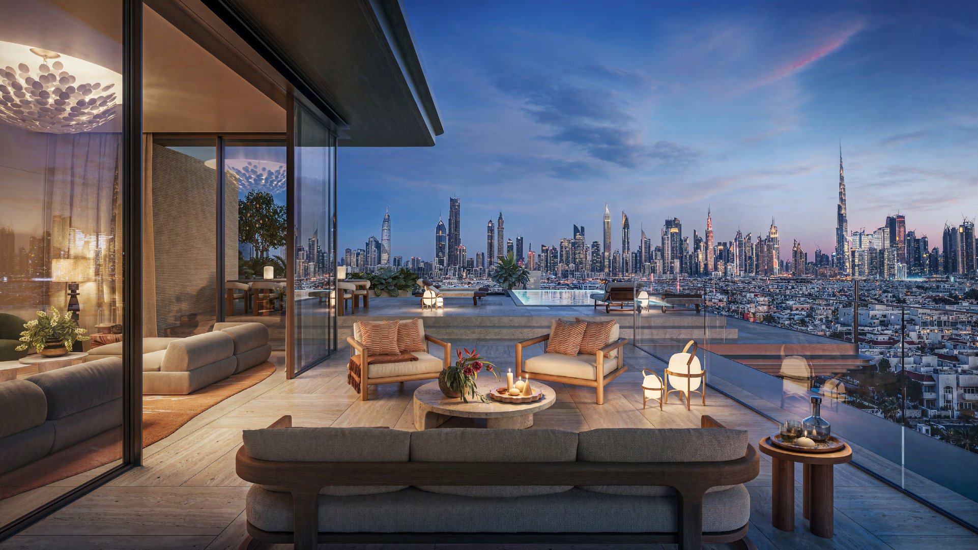 Penthouse terrace and private pool at dusk facing the lit city skyline